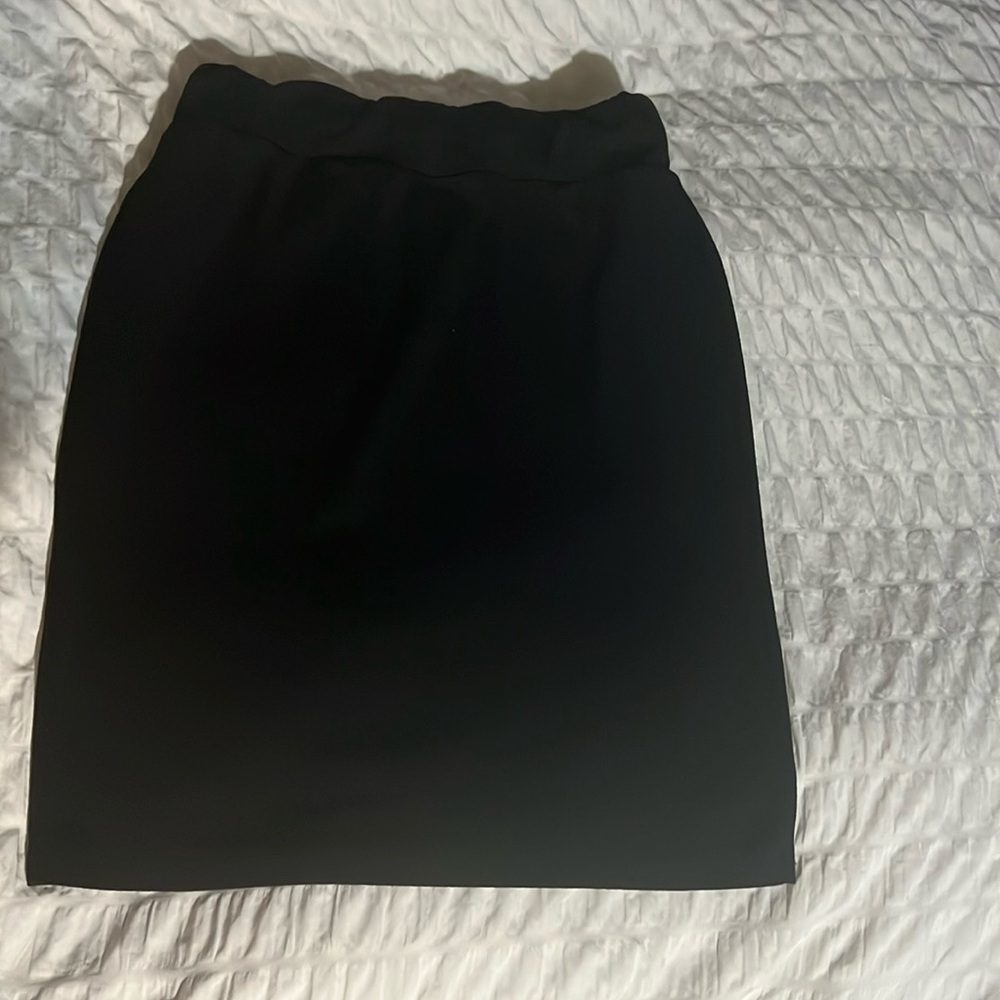 Black pencil skirt. Length 24in